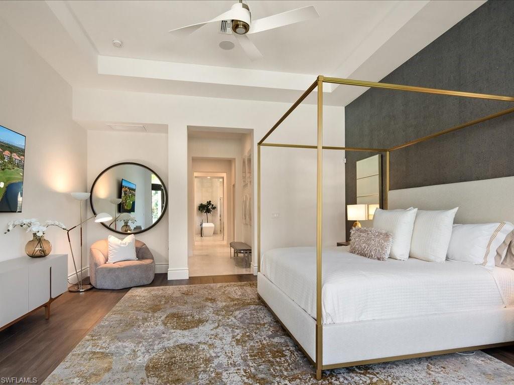 2581 Escada Drive Naples, FL 34109 - Photo 20 of 39 a view of a bedroom with a bed and a large window