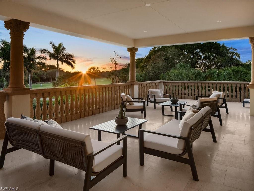 2581 Escada Drive Naples, FL 34109 - Photo 27 of 39 a roof deck with couches and wooden floor