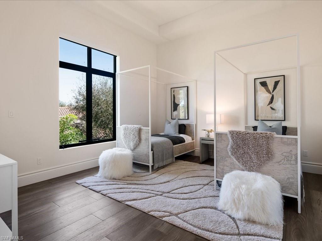 2581 Escada Drive Naples, FL 34109 - Photo 31 of 39 a living room with furniture and a large window