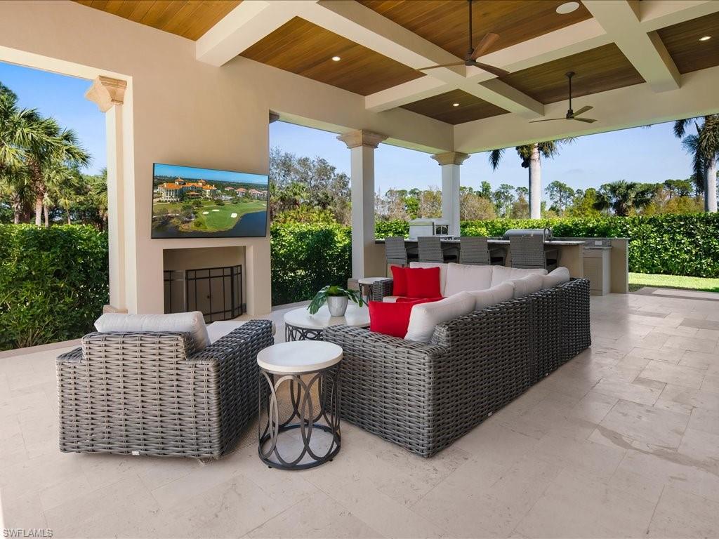 2581 Escada Drive Naples, FL 34109 - Photo 9 of 39 a building outdoor space with patio furniture and potted plants