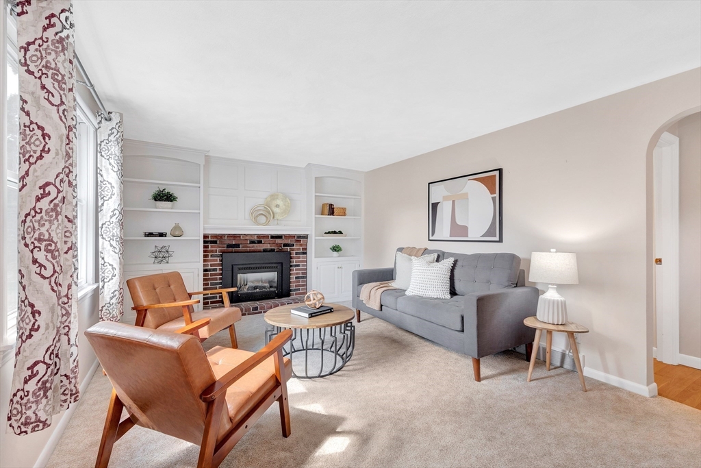 443 A North Road Bedford, MA 01730 - Photo 11 of 36 a living room with furniture and a fireplace