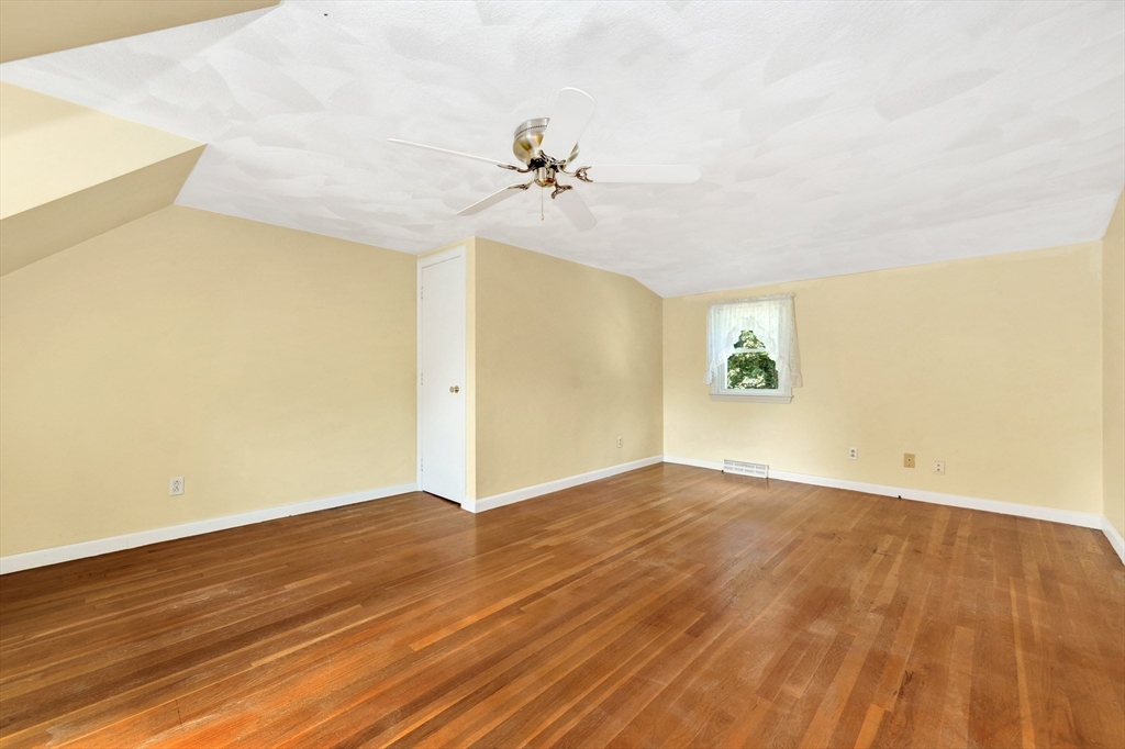 443 A North Road Bedford, MA 01730 - Photo 26 of 36 an empty room with a windows and chandelier fan