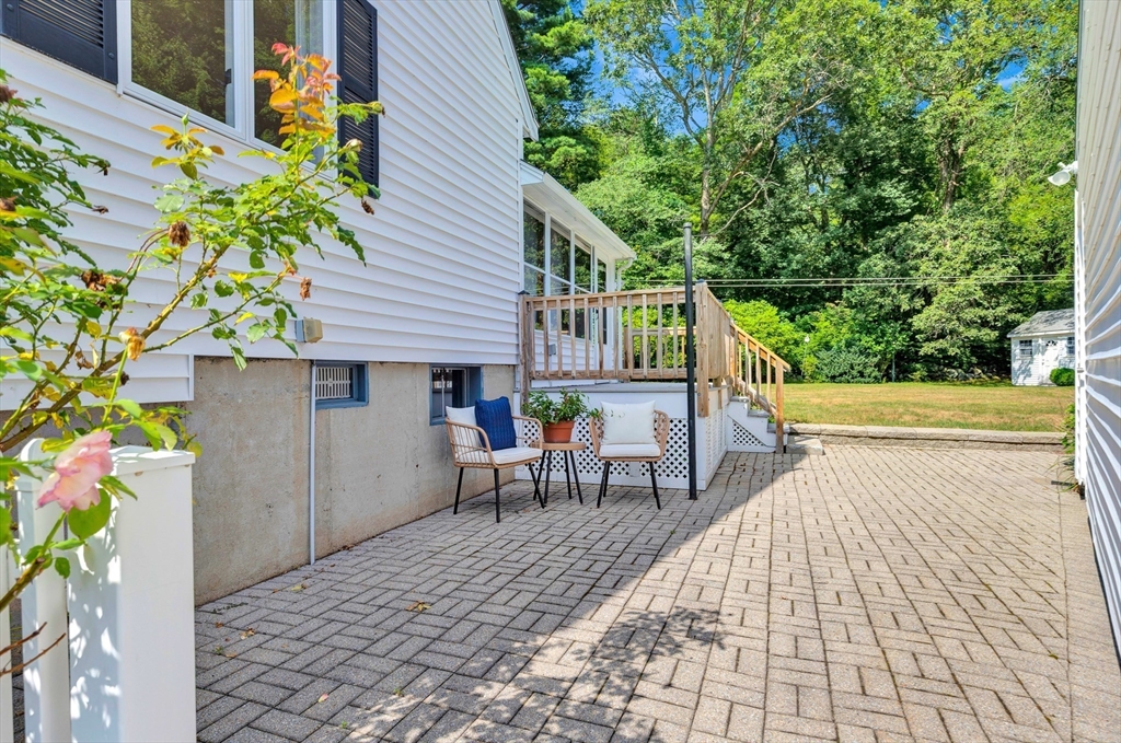 443 A North Road Bedford, MA 01730 - Photo 30 of 36 a view of a patio with table and chairs and potted plants