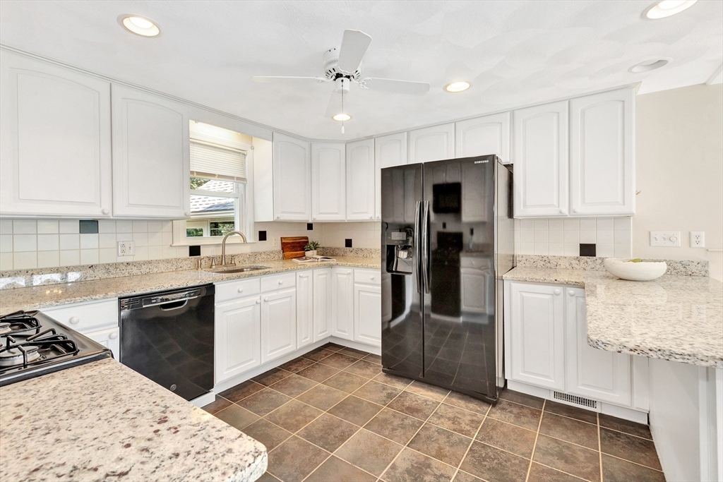443 A North Road Bedford, MA 01730 - Photo 4 of 36 a kitchen with a refrigerator stove top oven and sink