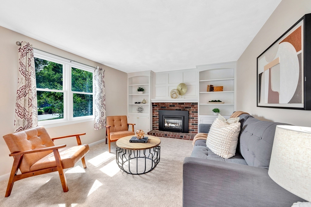443 A North Road Bedford, MA 01730 - Photo 10 of 36 a living room with furniture and a fireplace