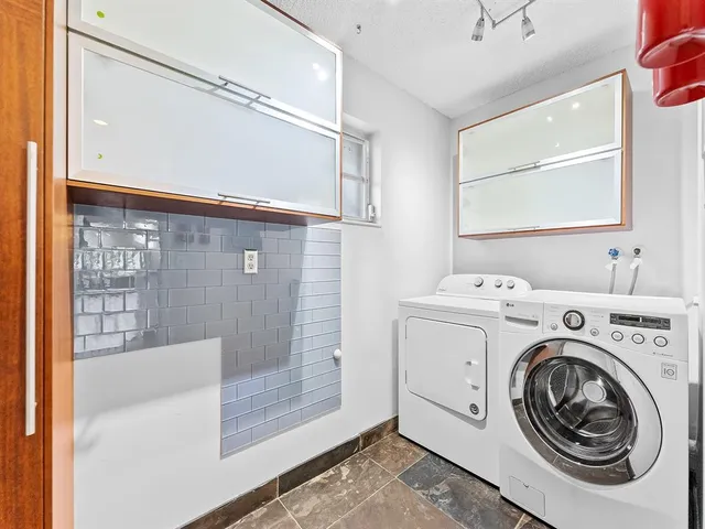 a utility room with dryer and washer