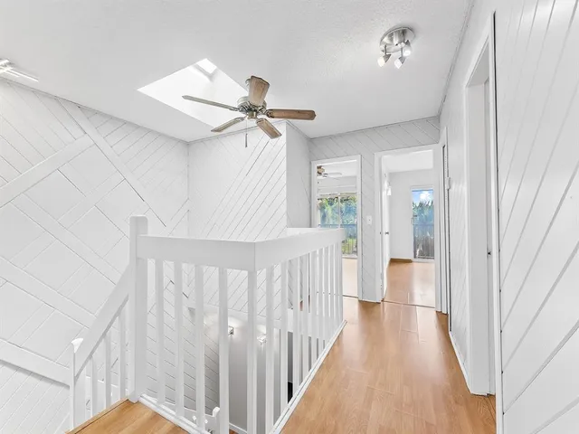 a view of a hallway with a white walls