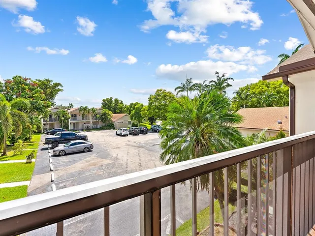 a view of a garden from a balcony