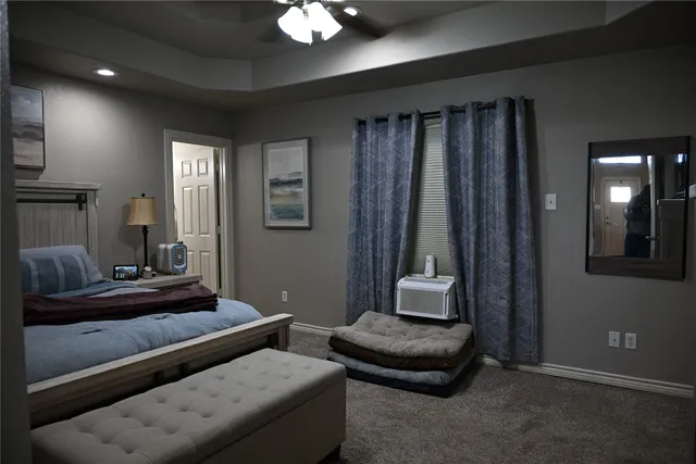 a living room with furniture and a mirror