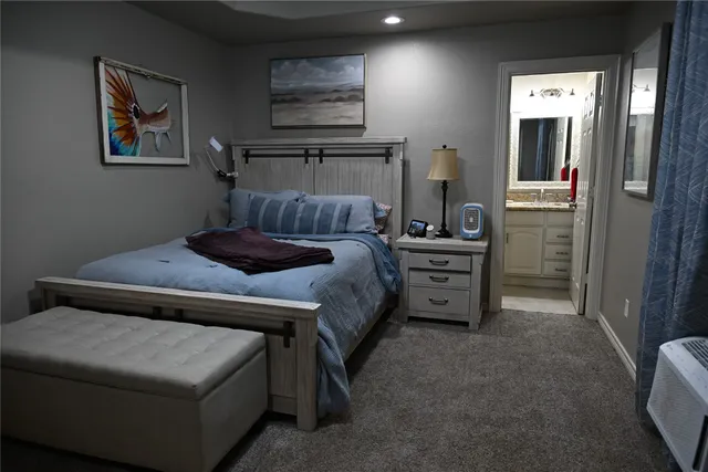 a bedroom with a bed and furniture