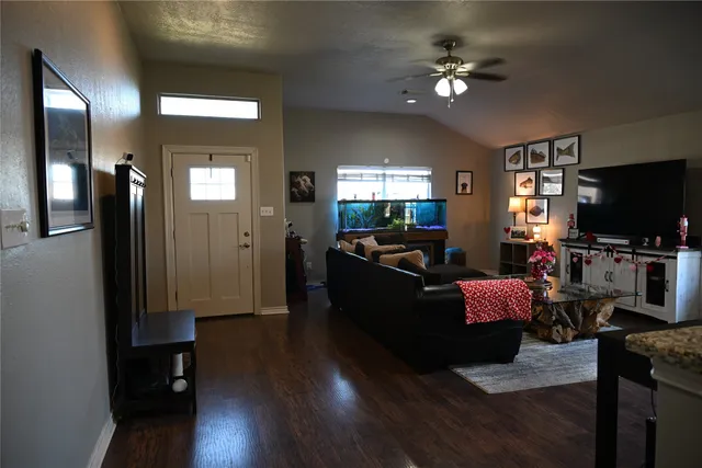 a living room with furniture and a flat screen tv