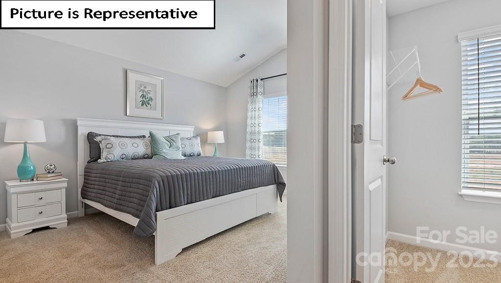 9027 Lowfalls Lane Charlotte, NC 28216 - Photo 15 of 27 a bedroom with a bed and a window