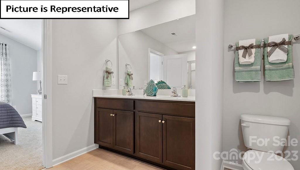 9027 Lowfalls Lane Charlotte, NC 28216 - Photo 18 of 27 a bathroom with a sink and a mirror
