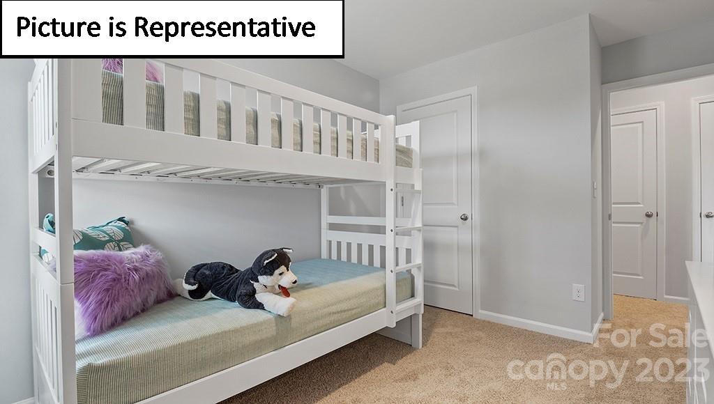 9027 Lowfalls Lane Charlotte, NC 28216 - Photo 22 of 27 a bedroom with a bed and a window