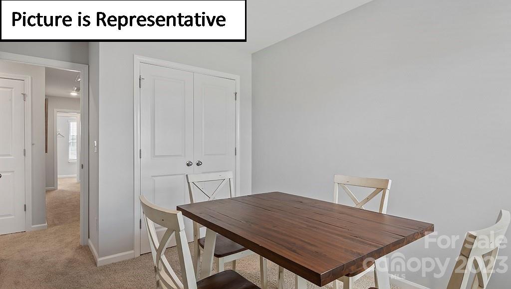 9027 Lowfalls Lane Charlotte, NC 28216 - Photo 24 of 27 a view of a table and chairs in a room