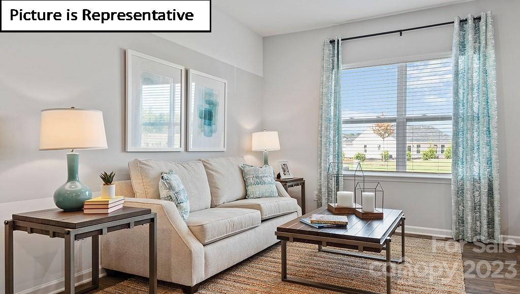9027 Lowfalls Lane Charlotte, NC 28216 - Photo 5 of 27 a living room with furniture and a window