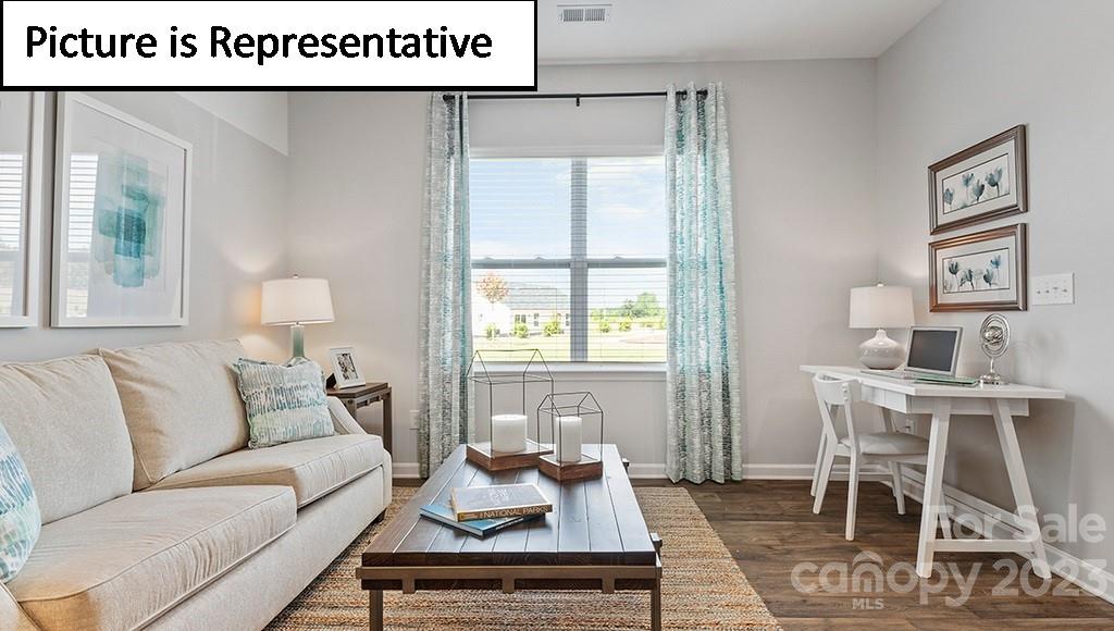 9027 Lowfalls Lane Charlotte, NC 28216 - Photo 6 of 27 a living room with furniture and a table