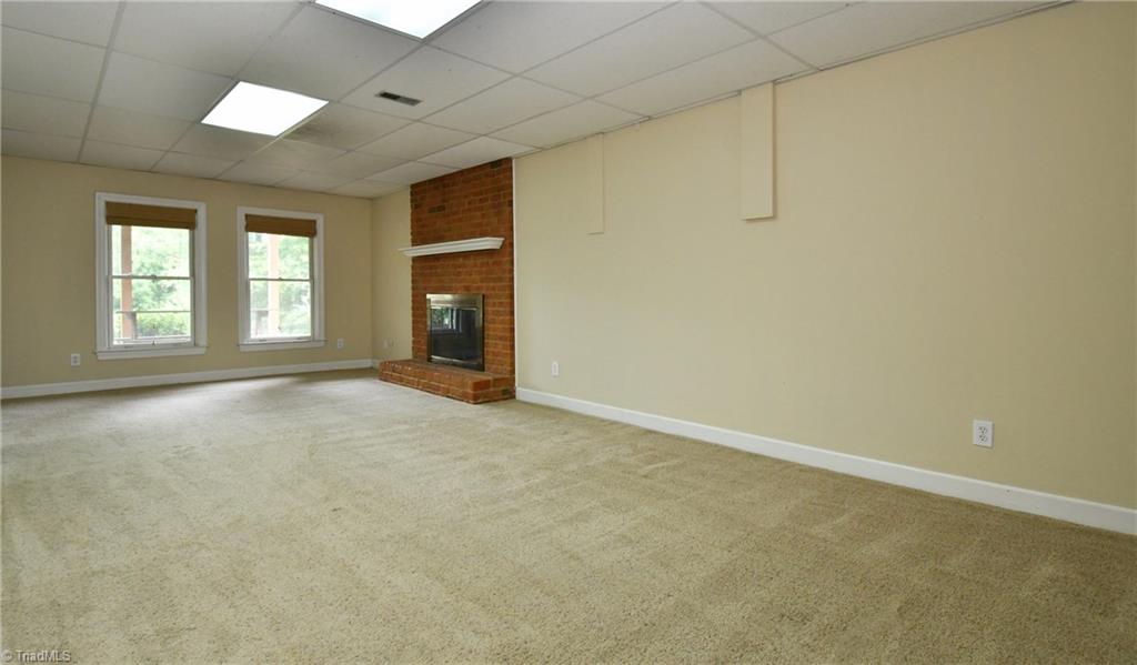 8040 Glengarriff Road Clemmons, NC 27012 - Photo 18 of 26 Playroom w/ FP & full bath in walkout lower level