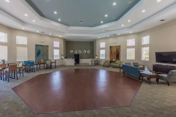 a room with gym equipment and a large window