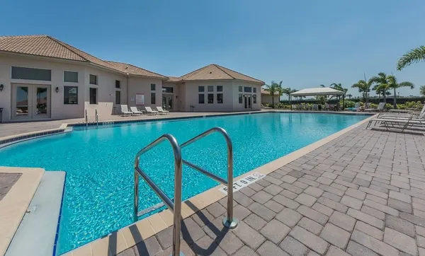 an aerial view of a house with a swimming pool