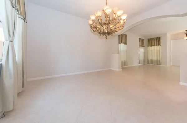 a open kitchen with stainless steel appliances granite countertop a stove top oven a sink and a refrigerator