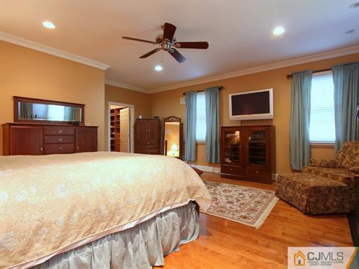 121 New Market Road Dunellen, NJ 08812 - Photo 12 of 23 a bed room with a bed mirror and a dresser