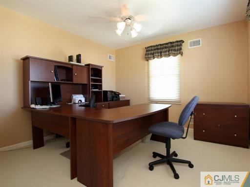 121 New Market Road Dunellen, NJ 08812 - Photo 17 of 23 a view of a workspace with furniture