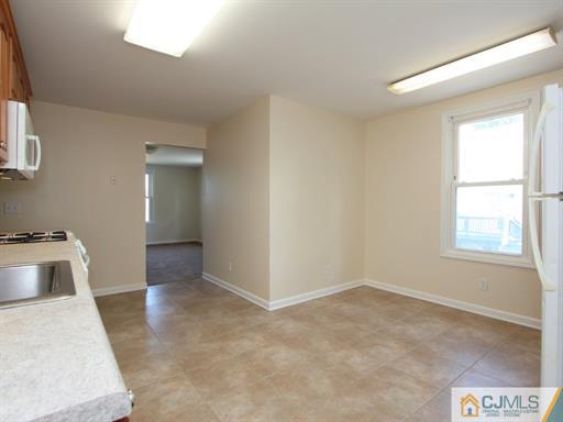 121 New Market Road Dunellen, NJ 08812 - Photo 21 of 23 a view of an empty room and window