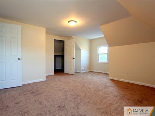 121 New Market Road Dunellen, NJ 08812 - Photo 23 of 23 an empty room with windows