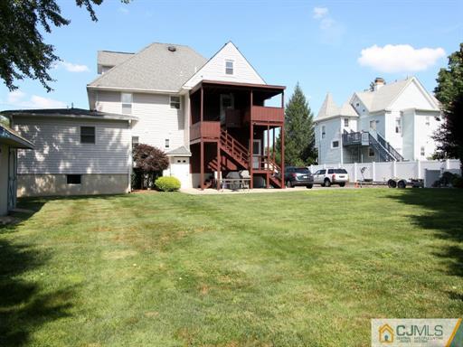 121 New Market Road Dunellen, NJ 08812 - Photo 6 of 23 a view of a house with basket ball court