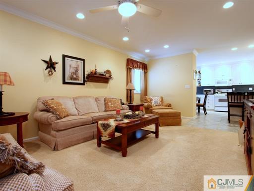 121 New Market Road Dunellen, NJ 08812 - Photo 8 of 23 a living room with furniture and a table