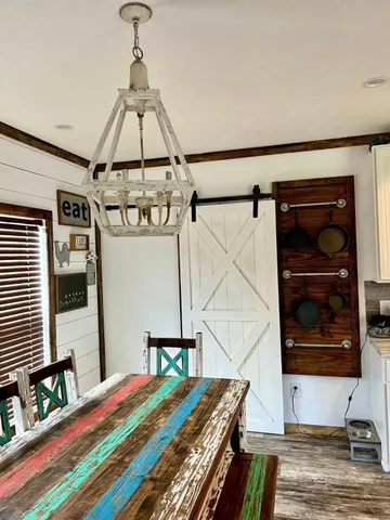 a living room with furniture gym equipment and a flat screen tv