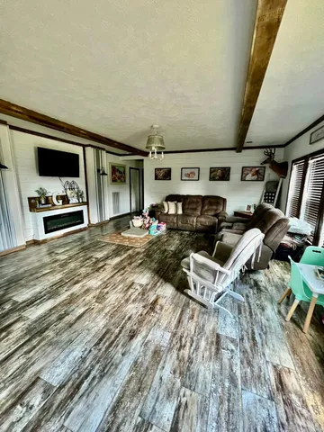 a bedroom with a bed window and wall painting