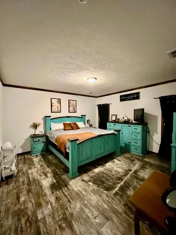 a large white kitchen with lots of counter space and stainless steel appliances