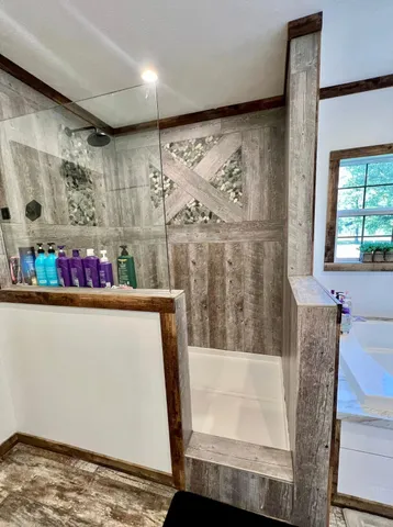 a bathroom with a double vanity sink and mirror