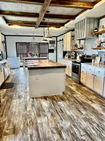 a view of kitchen with furniture and window