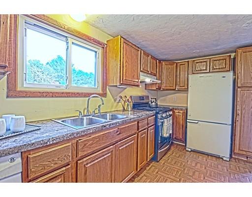 2 Clover Hill Road Acton, MA 01720 - Photo 5 of 11 a kitchen with stainless steel appliances granite countertop a refrigerator a sink dishwasher a stove with wooden cabinets and floor