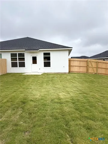 a house with yard in front of it