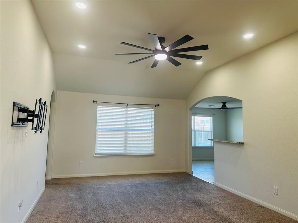 1314 Tamarack Drive Princeton, TX 75407 - Photo 7 of 12 an empty room with windows and cabinet