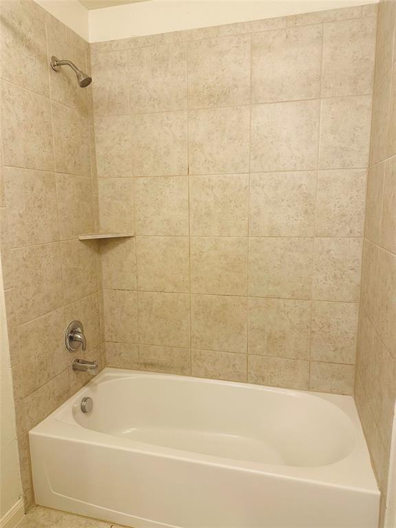1314 Tamarack Drive Princeton, TX 75407 - Photo 10 of 12 a bathroom with a bathtub