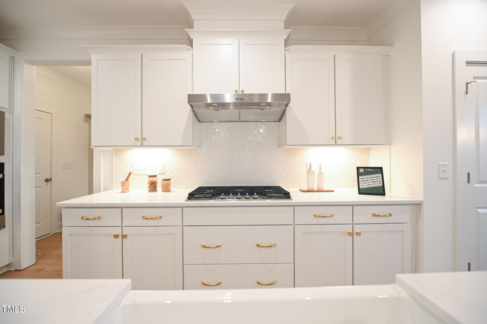 143 Sallyport Court Raleigh, NC 27603 - Photo 15 of 46 a kitchen with cabinets appliances and a sink