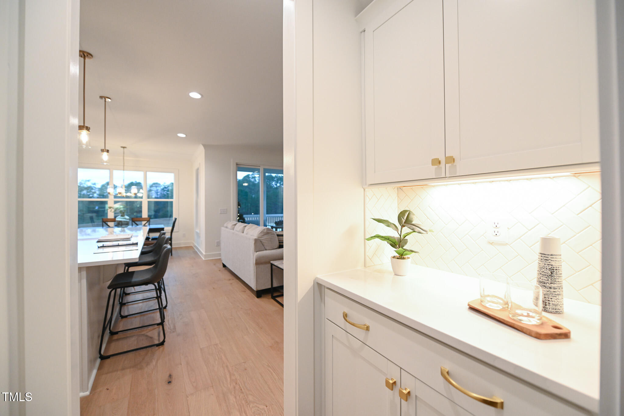 143 Sallyport Court Raleigh, NC 27603 - Photo 17 of 46 a kitchen with counter and chairs