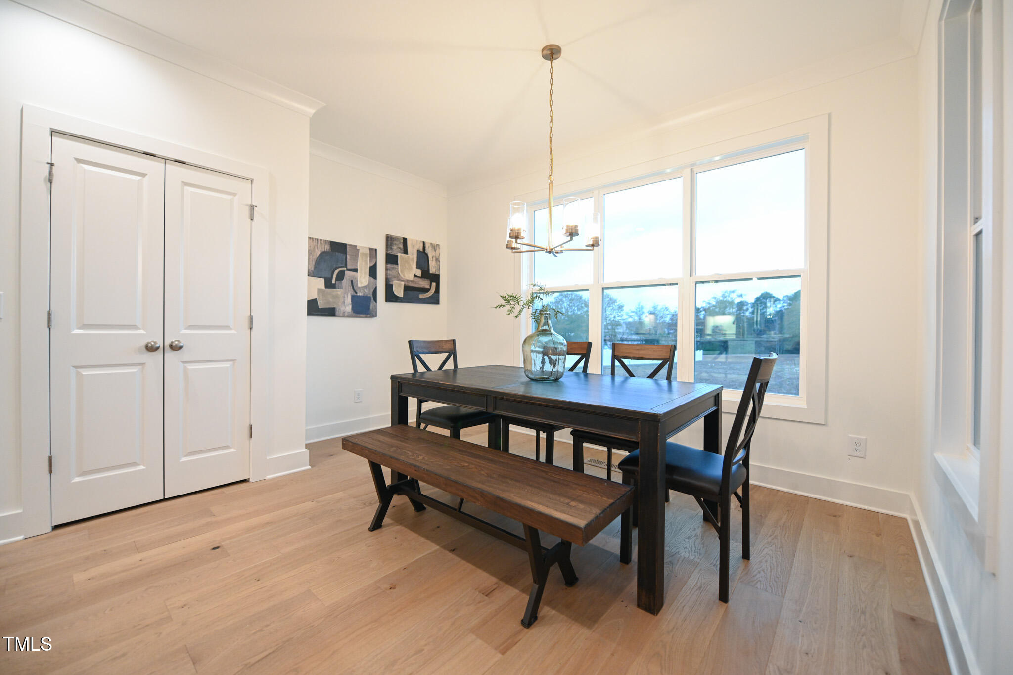 143 Sallyport Court Raleigh, NC 27603 - Photo 18 of 46 a view of a dining room with furniture window and wooden floor