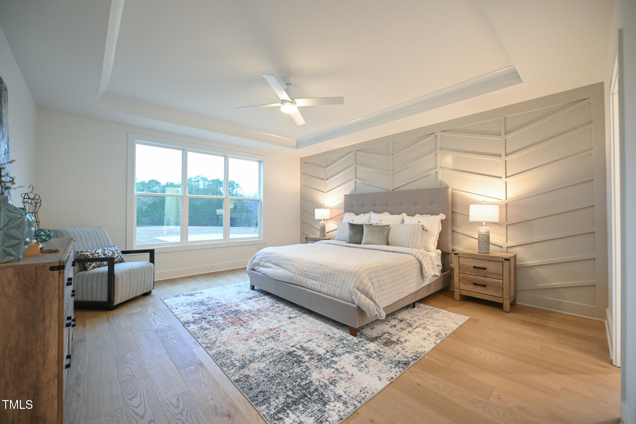 143 Sallyport Court Raleigh, NC 27603 - Photo 20 of 46 a spacious bedroom with a large bed and wooden floor