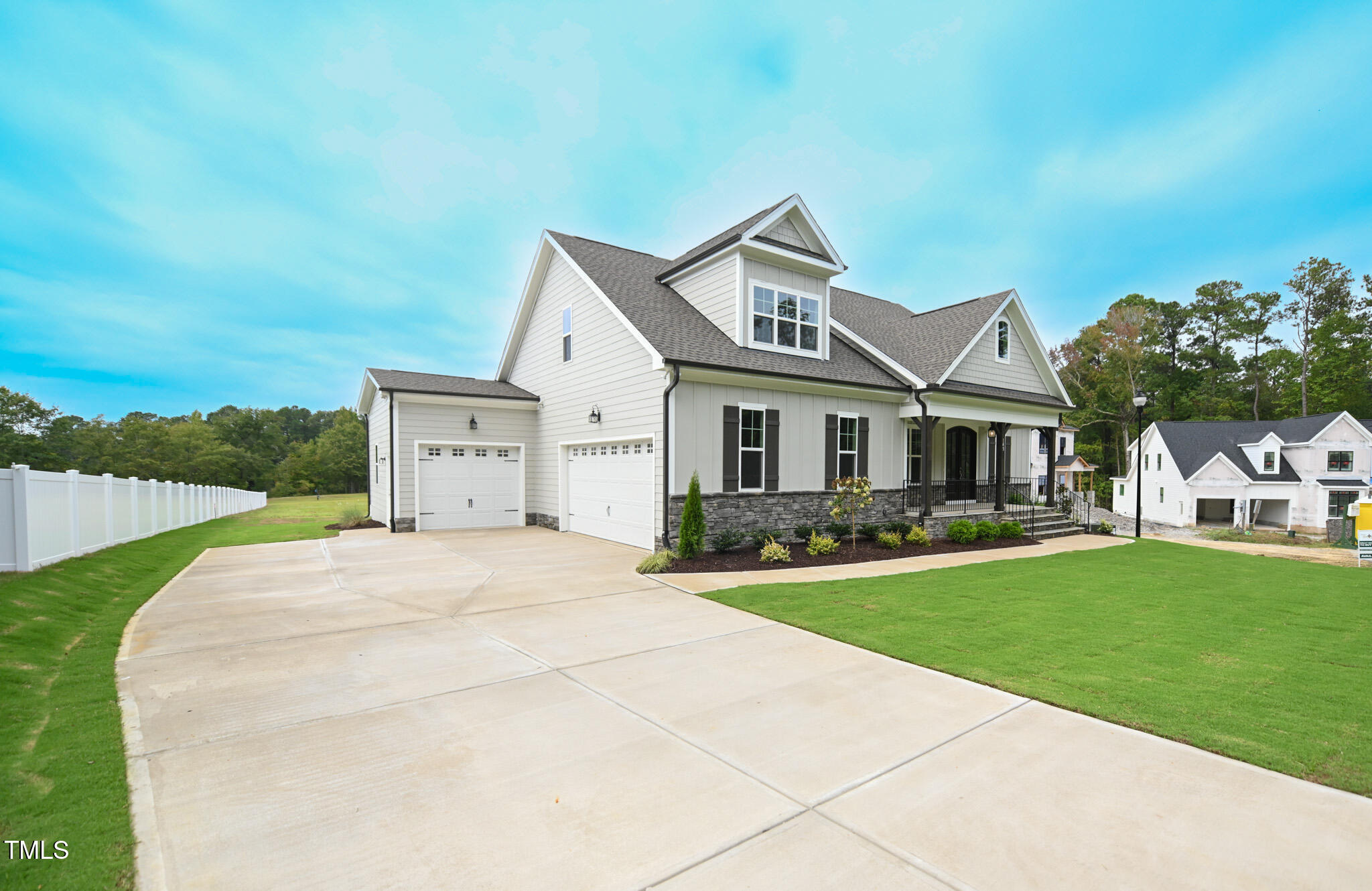 143 Sallyport Court Raleigh, NC 27603 - Photo 2 of 46 a front view of a house with a yard and garage