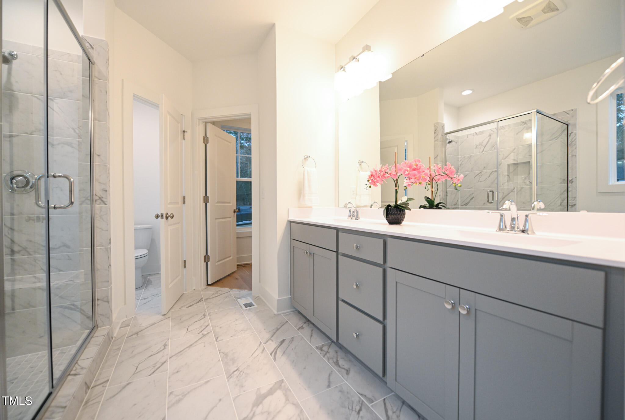 143 Sallyport Court Raleigh, NC 27603 - Photo 23 of 46 a bathroom with a double vanity sink mirror and shower