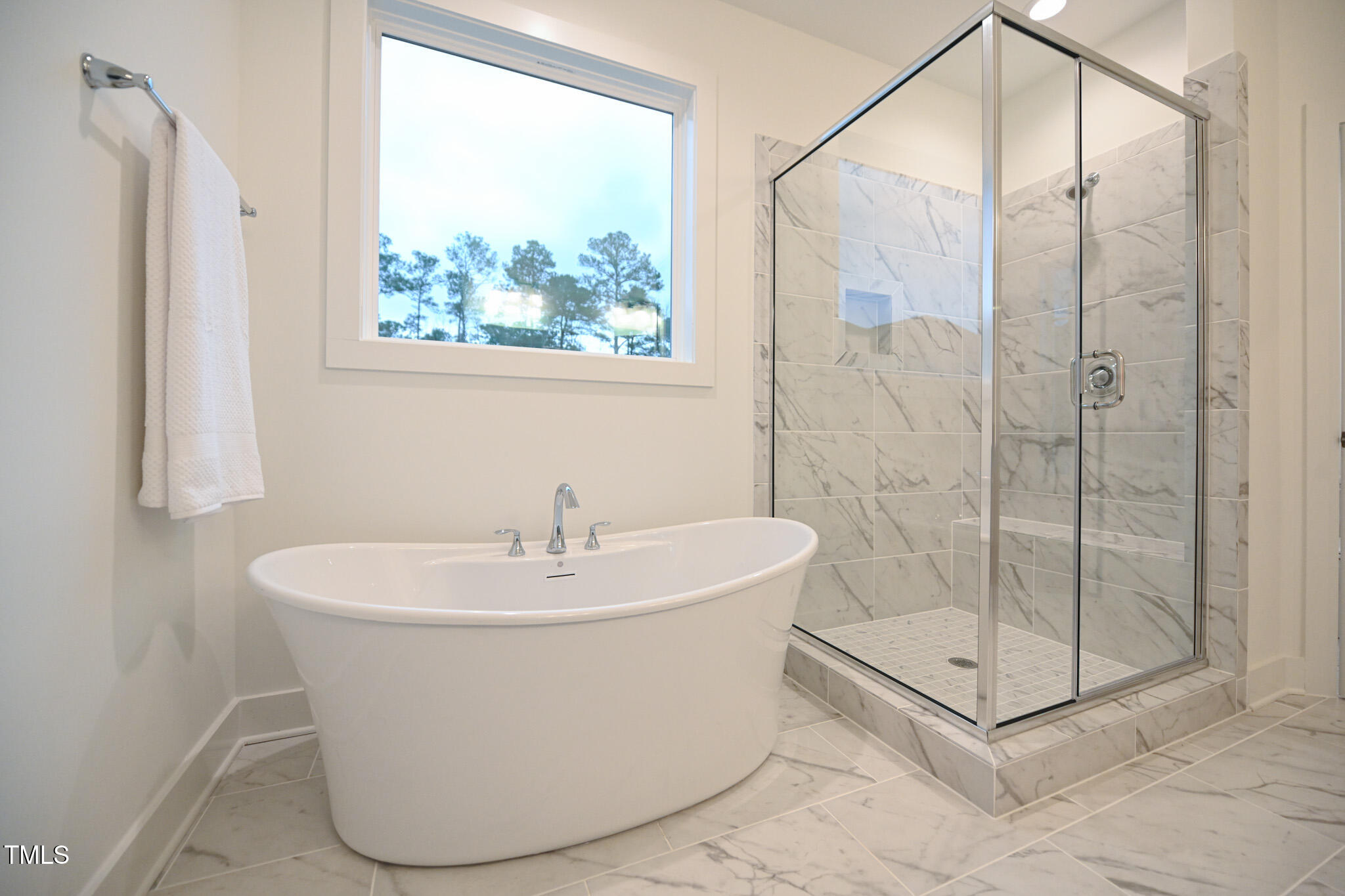 143 Sallyport Court Raleigh, NC 27603 - Photo 24 of 46 a white bath tub sitting next to a shower