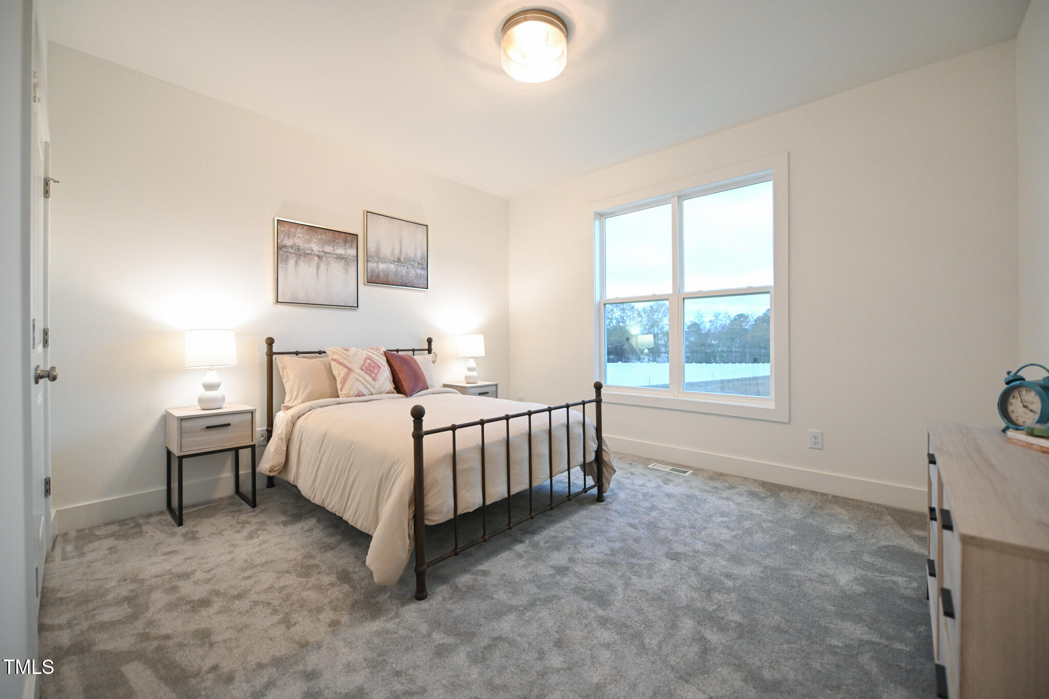 143 Sallyport Court Raleigh, NC 27603 - Photo 27 of 46 a bedroom with a bed and a window