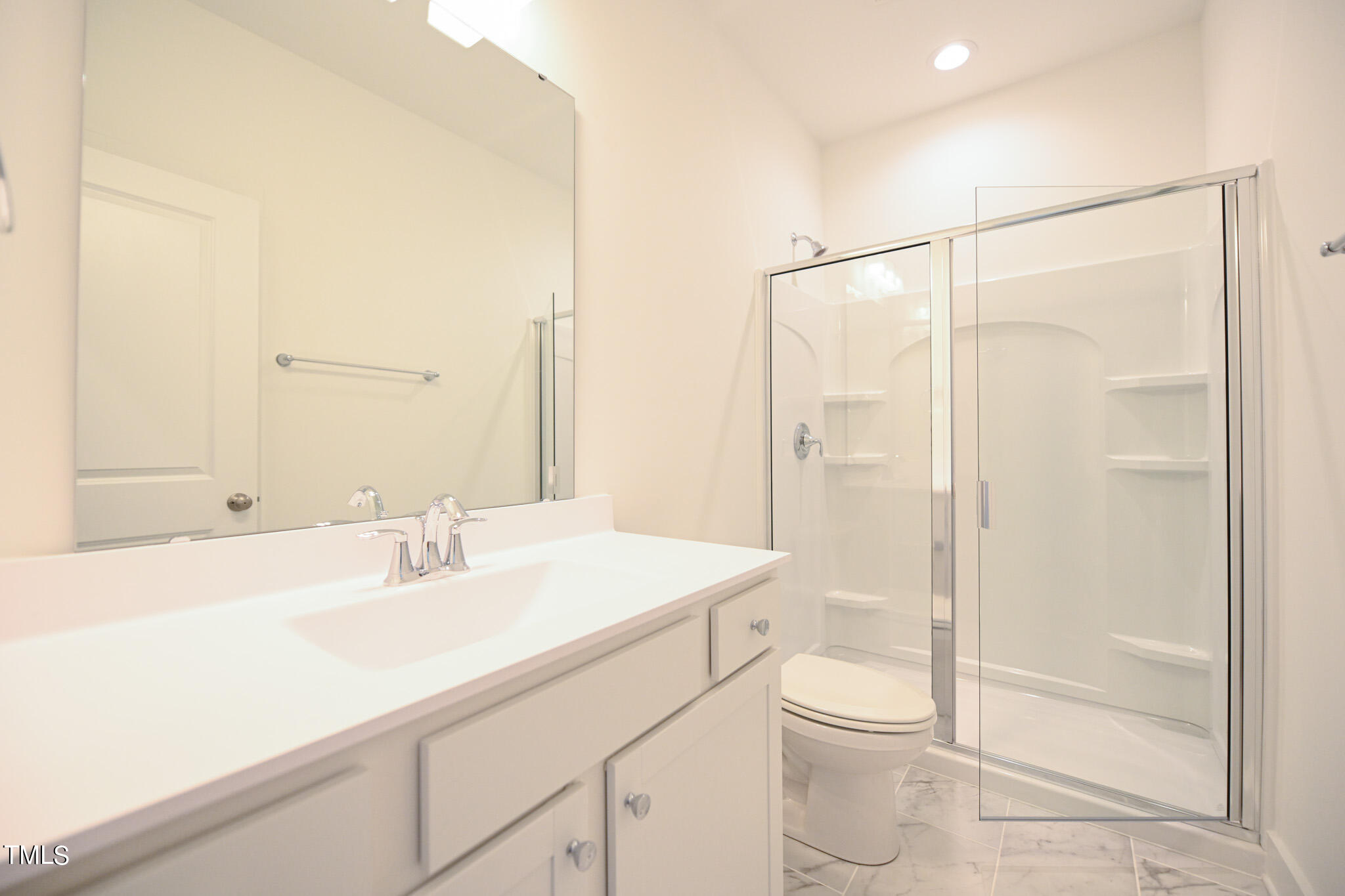143 Sallyport Court Raleigh, NC 27603 - Photo 30 of 46 a bathroom with a sink a toilet and shower