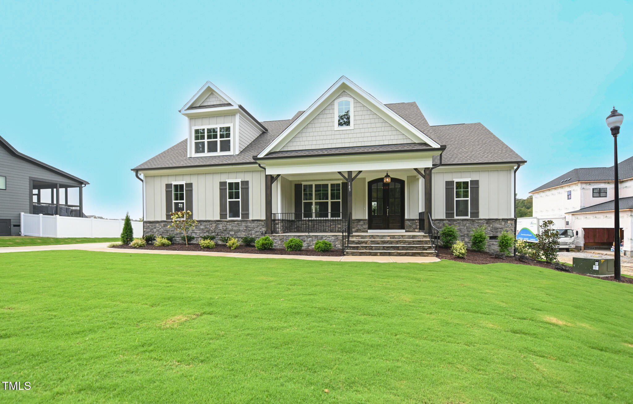 143 Sallyport Court Raleigh, NC 27603 - Photo 3 of 46 a front view of a house with a garden and porch